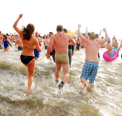 Coney Island, NY, USA January 1 On New Years Day, people wear their bathing suits and jump into the cold ocean waters during the Polar Bear Plunge on Coney Island New York